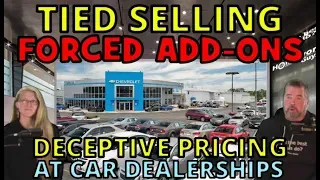 A large car dealership with cars parked in front of it.