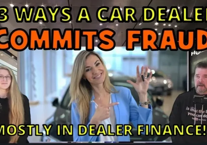 A woman holding up her car keys in front of another person.